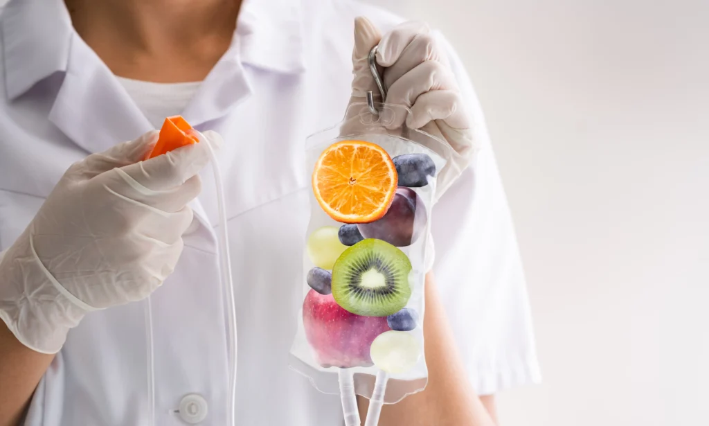 A Nurse holding a bag of fruits demonstrating vitamins with IV Drip Therapy in Freeland, MI