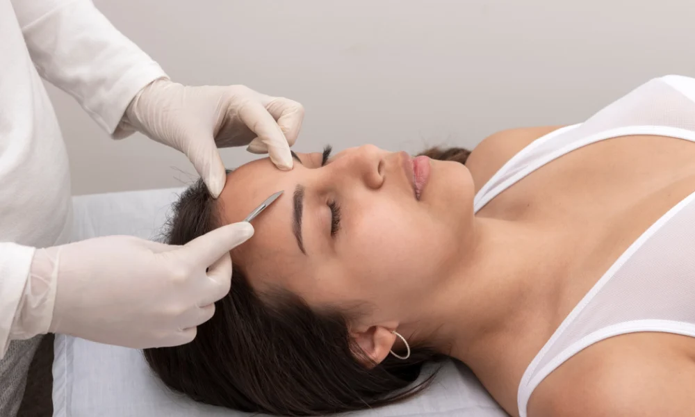 Dermaplaning treatment on a woman face at skincare clinic in Freeland, MI