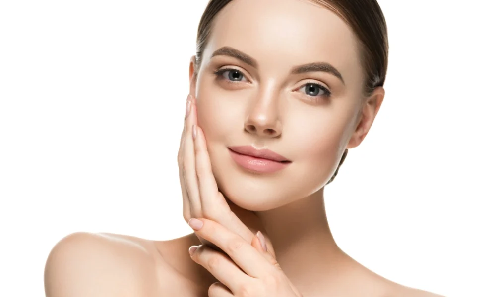 Woman showing glowing, smooth skin after microneedling treatment in Freeland, MI.